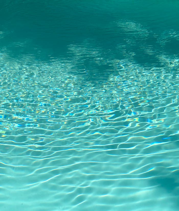 The Art of Drawing Readers In: Your attractive post title goes here From above of clear blue water of rippling pool on sunny day as abstract background